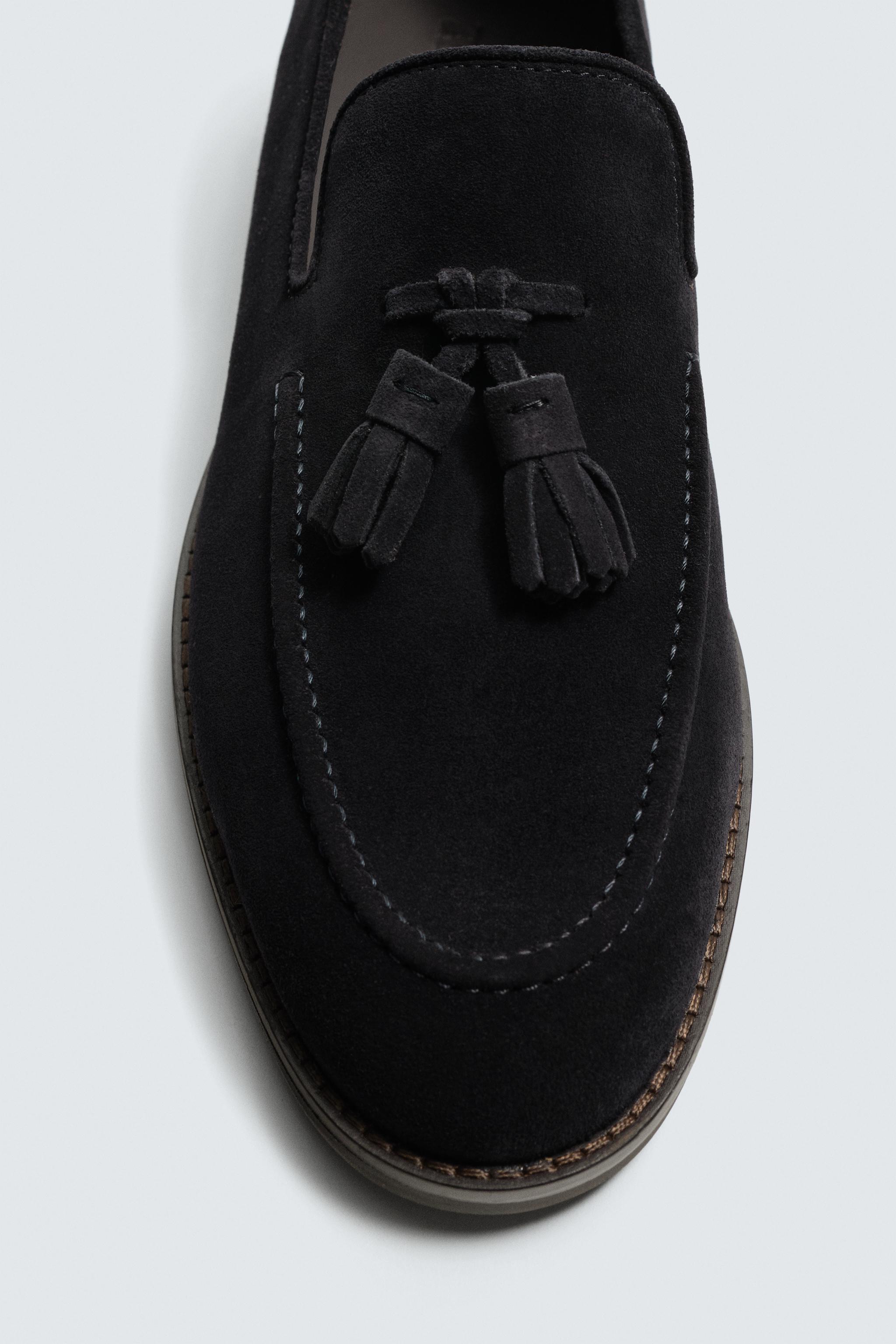 MOCASSINS EN CUIR À POMPONS